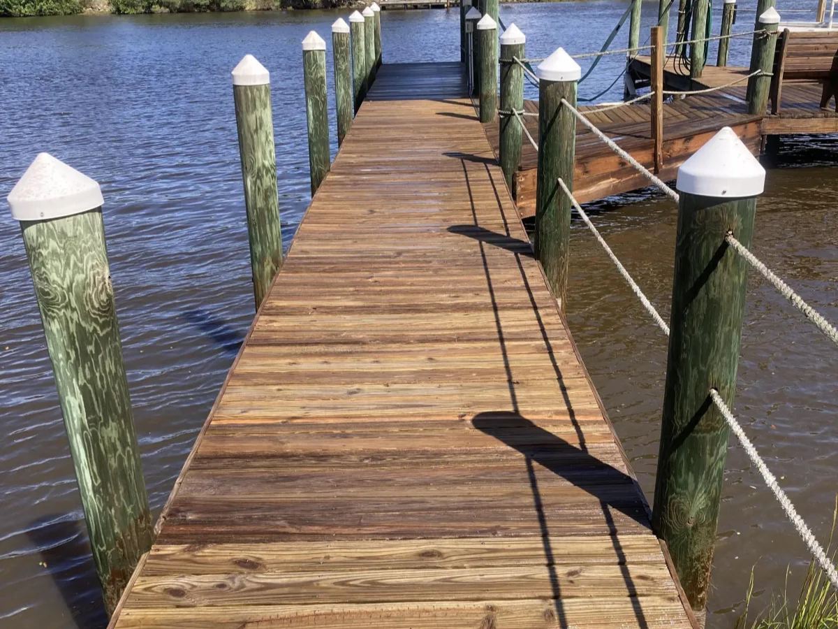 Freshly pressure washed wood dock, cleaned and restored