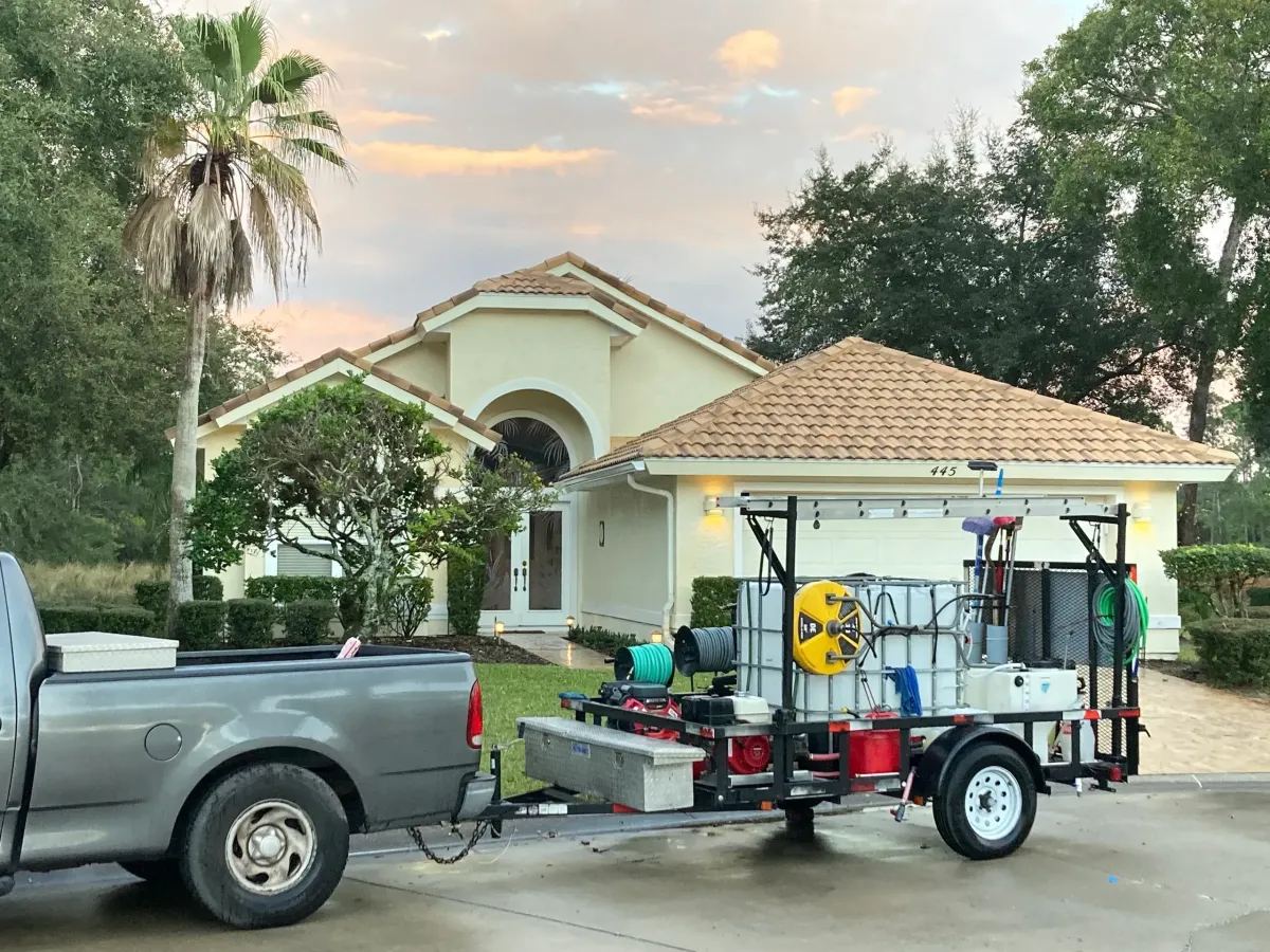 Wright's Southern Soft Wash truck and trailer parked at a Palm Coast home for a job