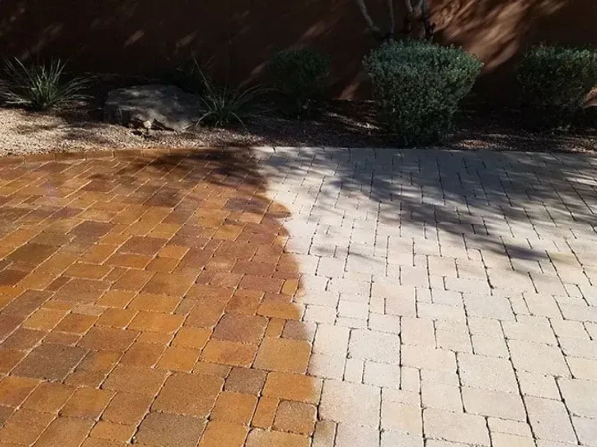 Paver walkway before and after pressure washing — stains lifted, original color restored